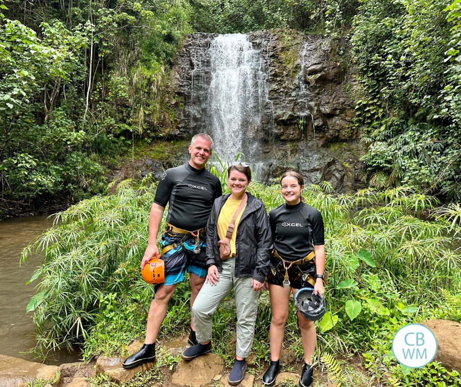 3 people in front of a waterfall in Kauai