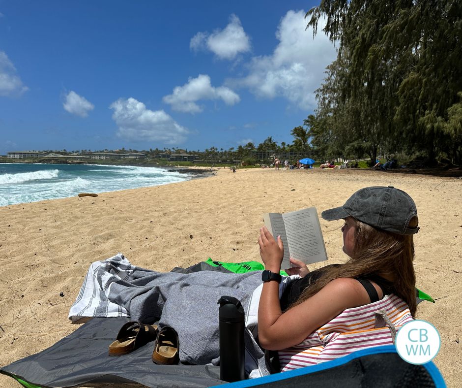 Kaitlyn sitting on the beach at Shipwreck beach