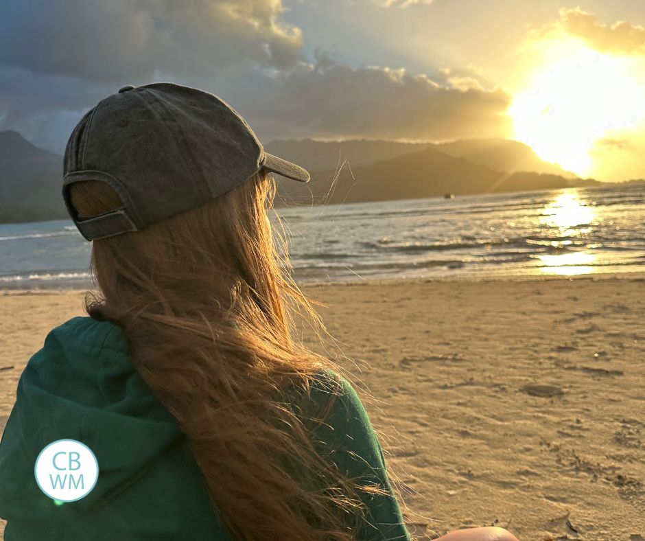 Kaitlyn looking at the sunset at Hanalie Bay